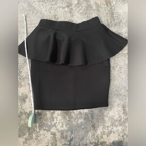 Never worn Black Bebe Peplum skirt